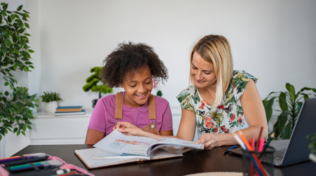 Parent helping child learn Spanish at home